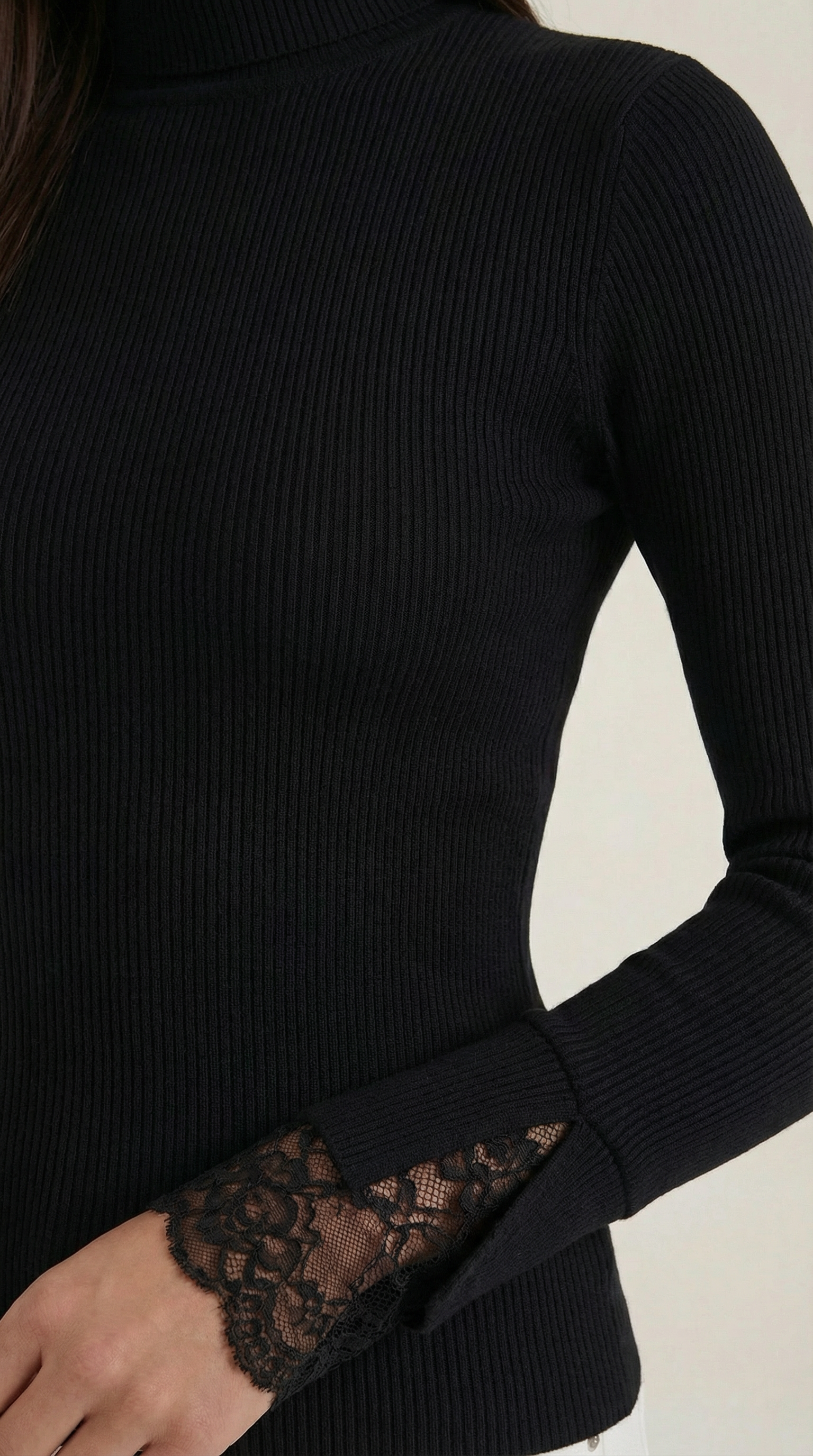 Black ribbed knit sleeve with lace cuff detail