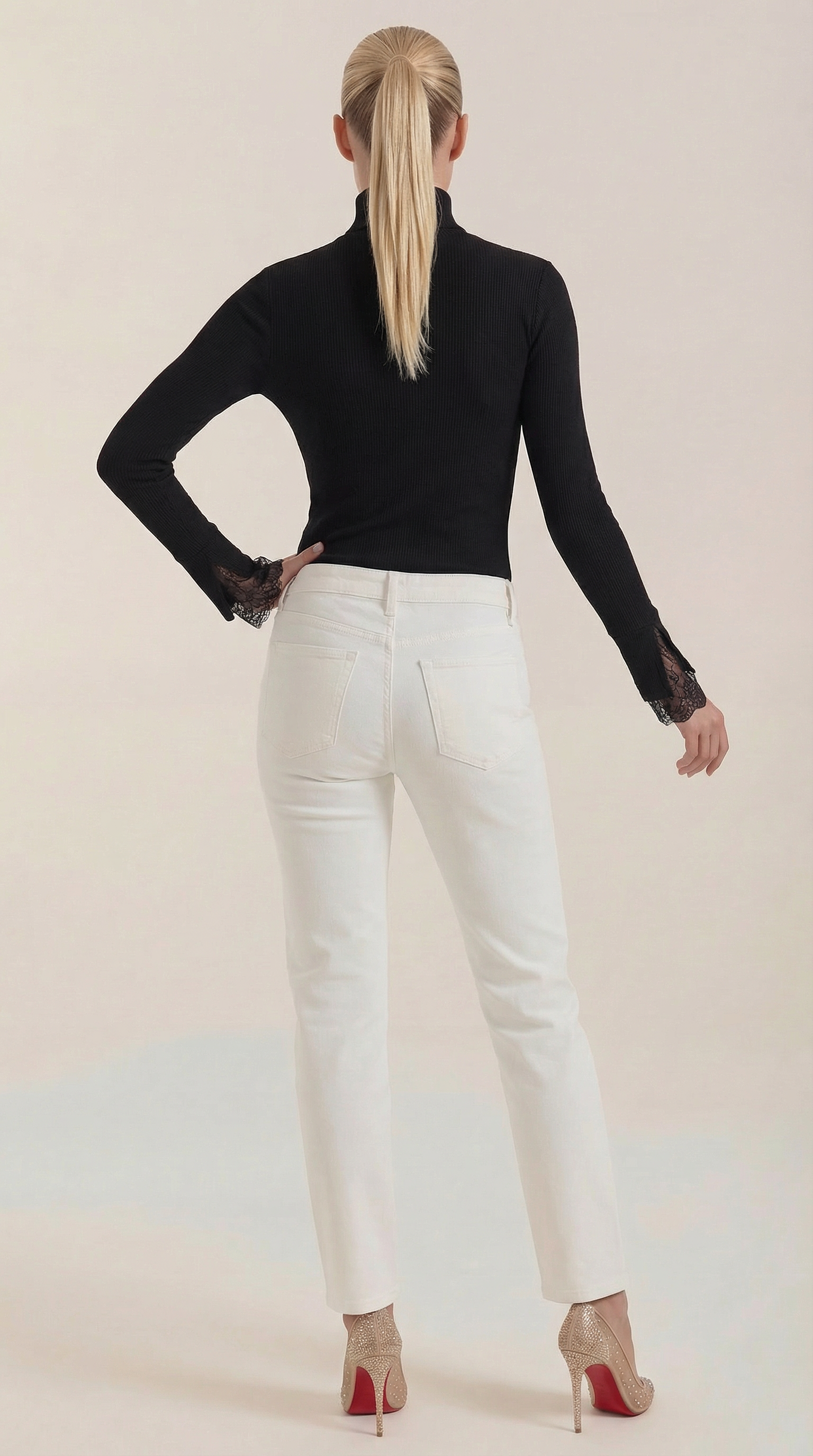 Black ribbed turtleneck with lace cuffs shown from back