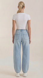 Women’s wide-leg jeans in light blue wash, back view with two patch pockets.