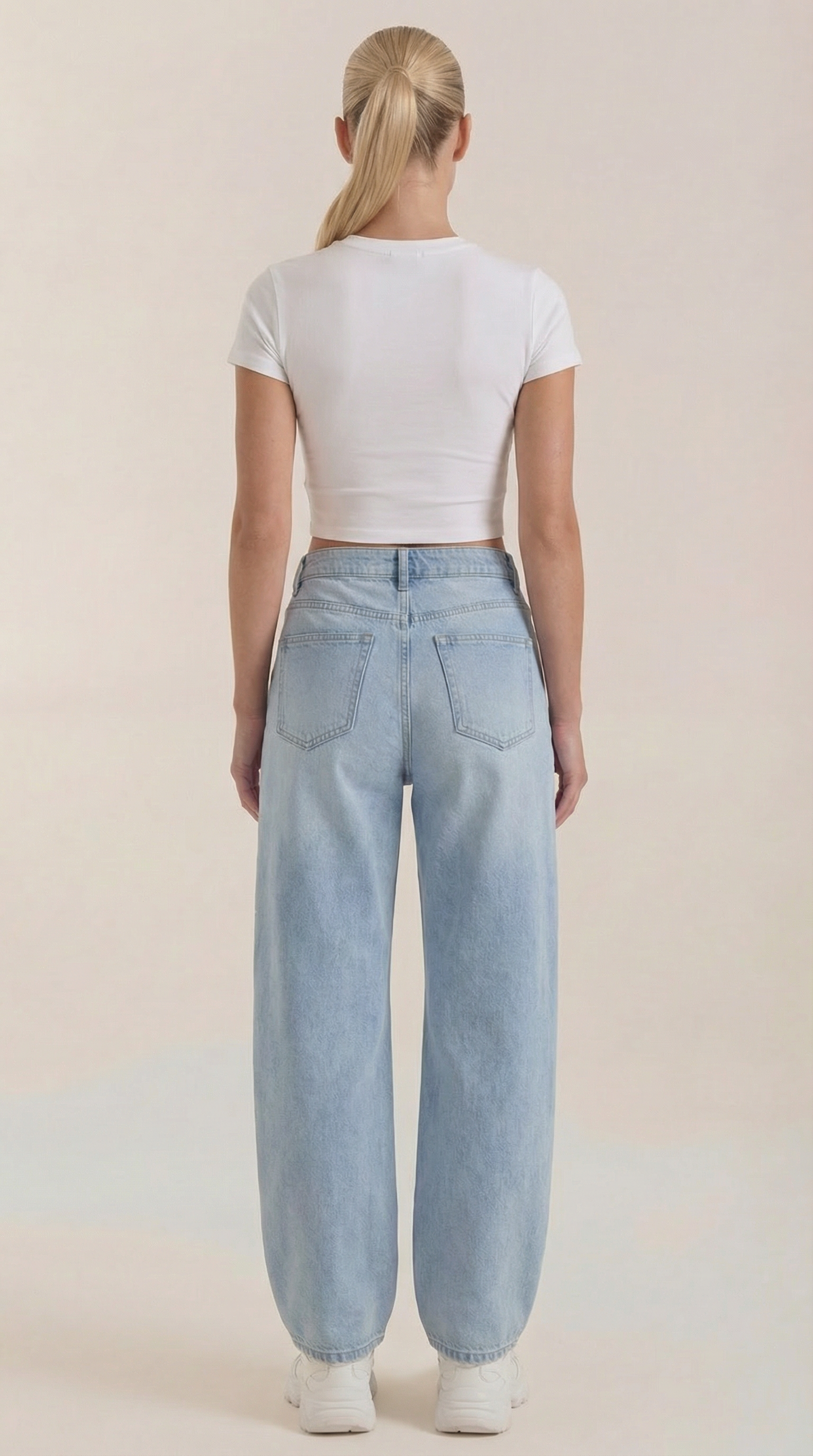 Women’s wide-leg jeans in light blue wash, back view with two patch pockets.