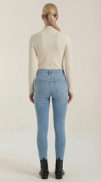 Beige cotton mock neck top from the back with long sleeves