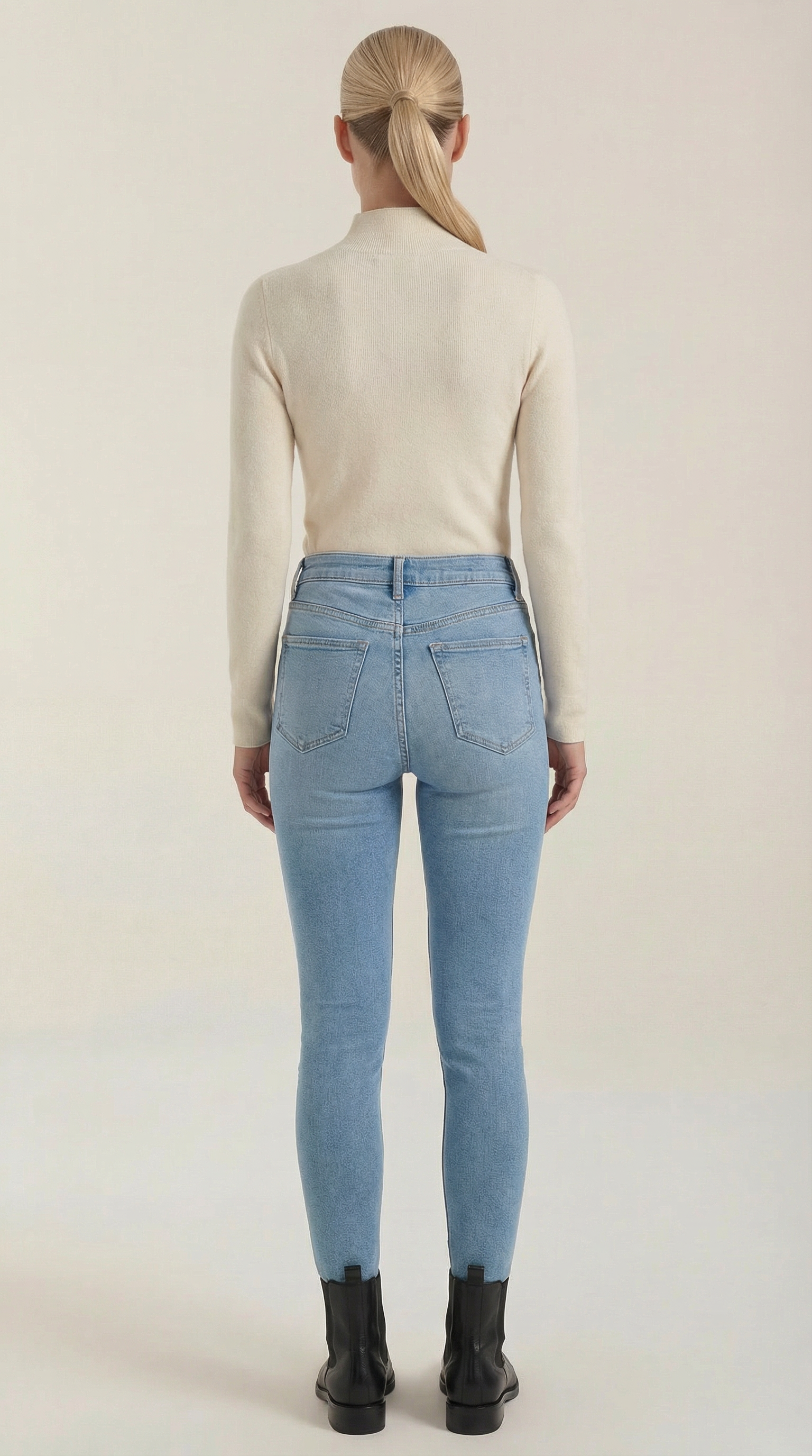 Beige cotton mock neck top from the back with long sleeves