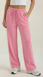 Pink wide-leg track pants with white side stripes and drawstring waist detail