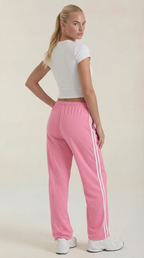 Pink wide-leg track pants with white side stripes and elastic drawstring waist