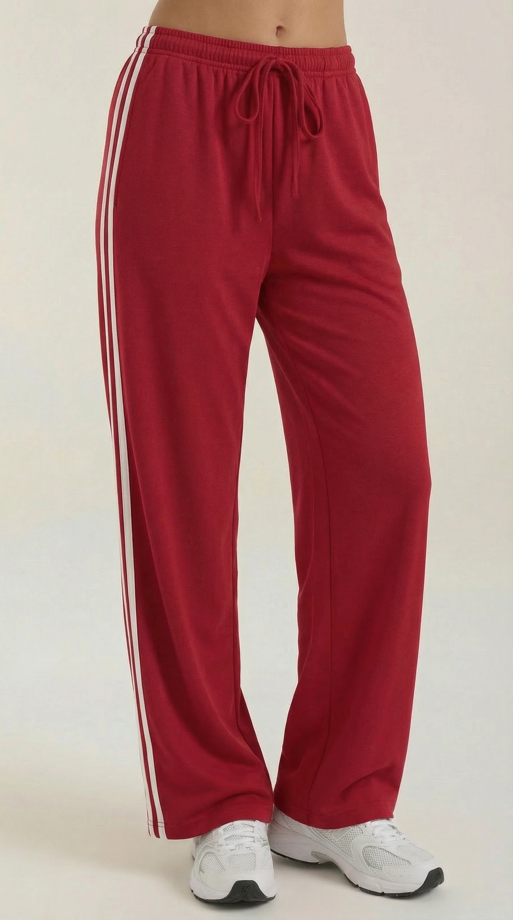 Red front wide-leg track pants with white side stripes, elastic waist and drawstring
