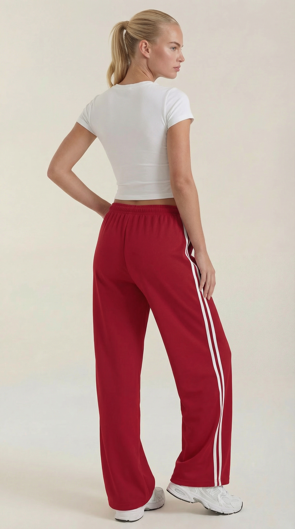Red back wide-leg track pants with white side stripes, elastic waist and drawstring