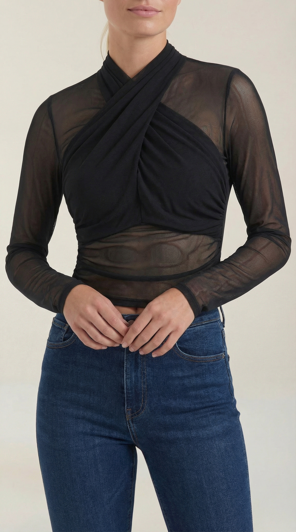 Black sheer wrap mesh top with draped crisscross neckline and long sleeves