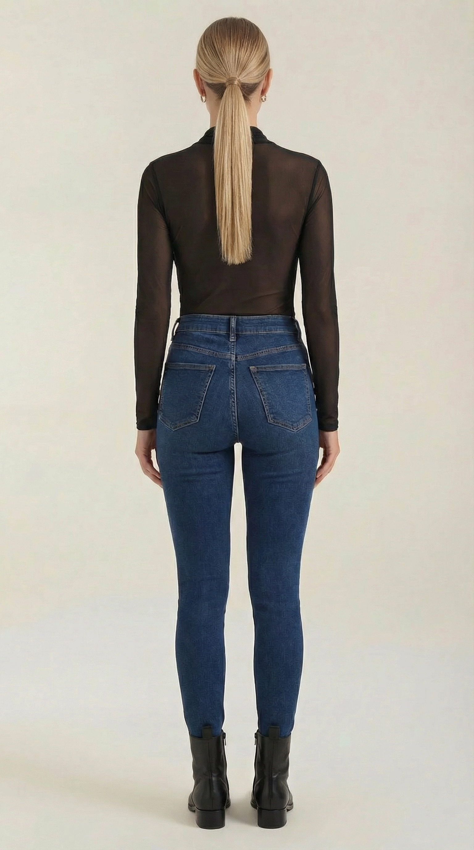 Black sheer wrap mesh top with long sleeves and open back drape
