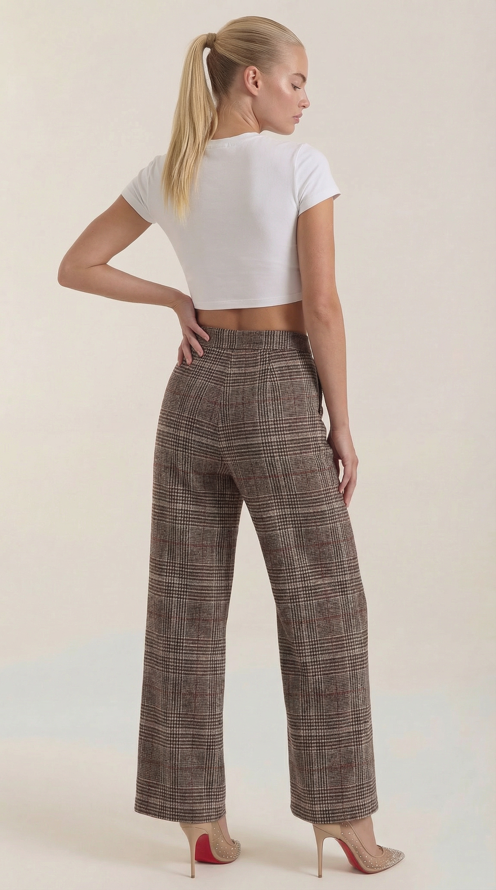 High-waisted brown plaid trousers, back view, wide legs with belt loops