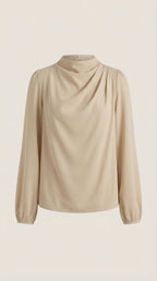 Beige draped long-sleeve blouse on mannequin with cowl neckline and puffed cuffs