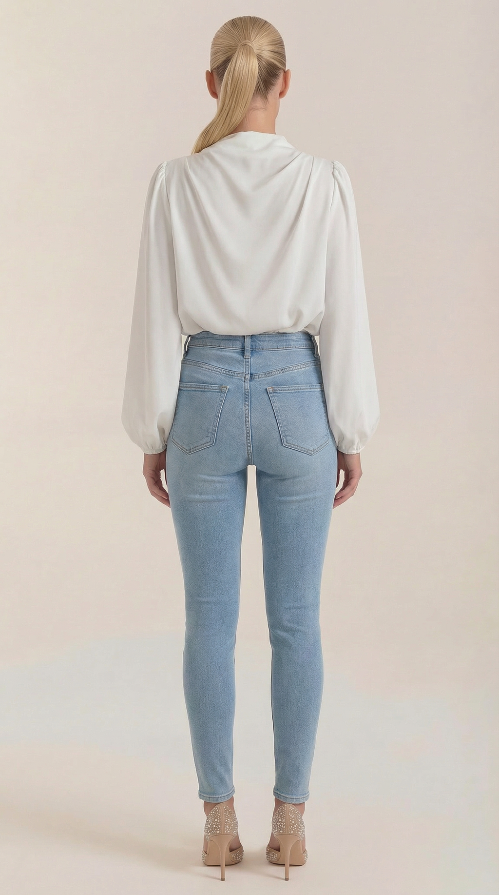 Back view draped long-sleeve blouse in white with pleated yoke and cowl neck