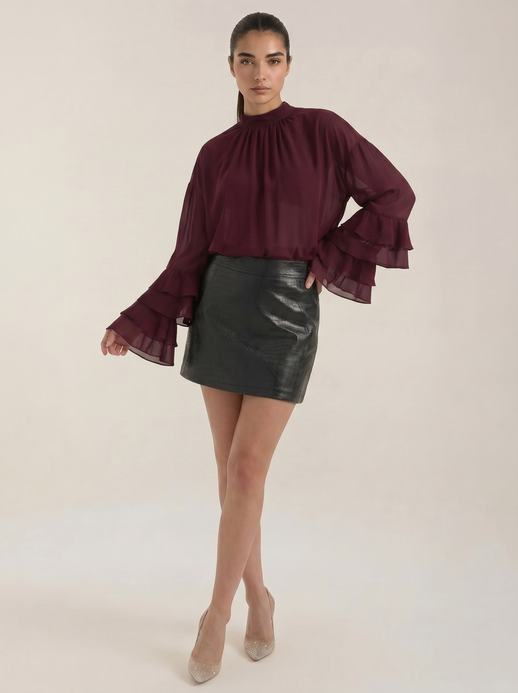 Burgundy sheer high mock-neck top with layered ruffle cuffs and billowy sleeves
