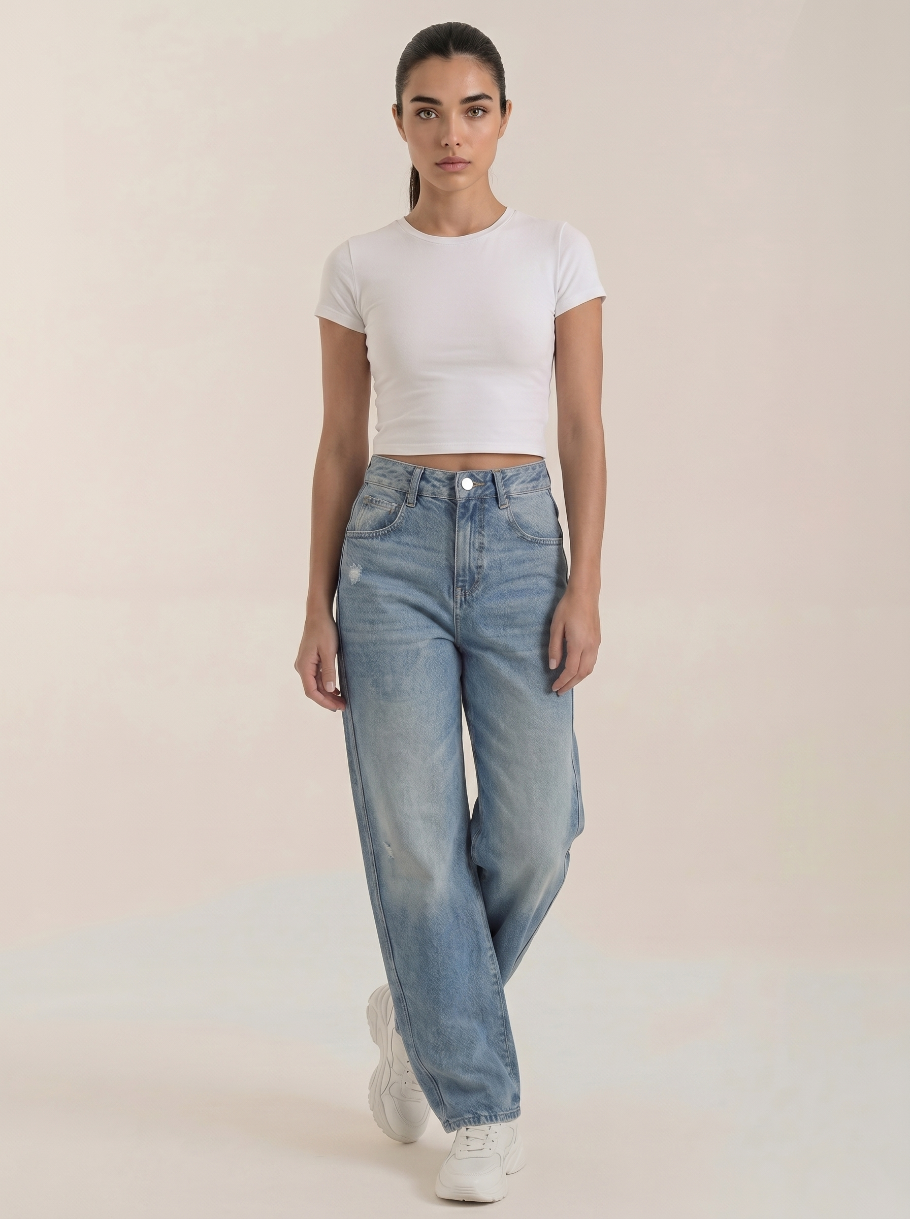 Women’s wide-leg jeans in light blue denim wash with button fly and tapered wide legs.