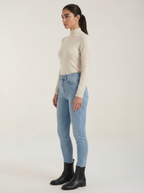 Beige cotton mock neck top with long sleeves, side profile