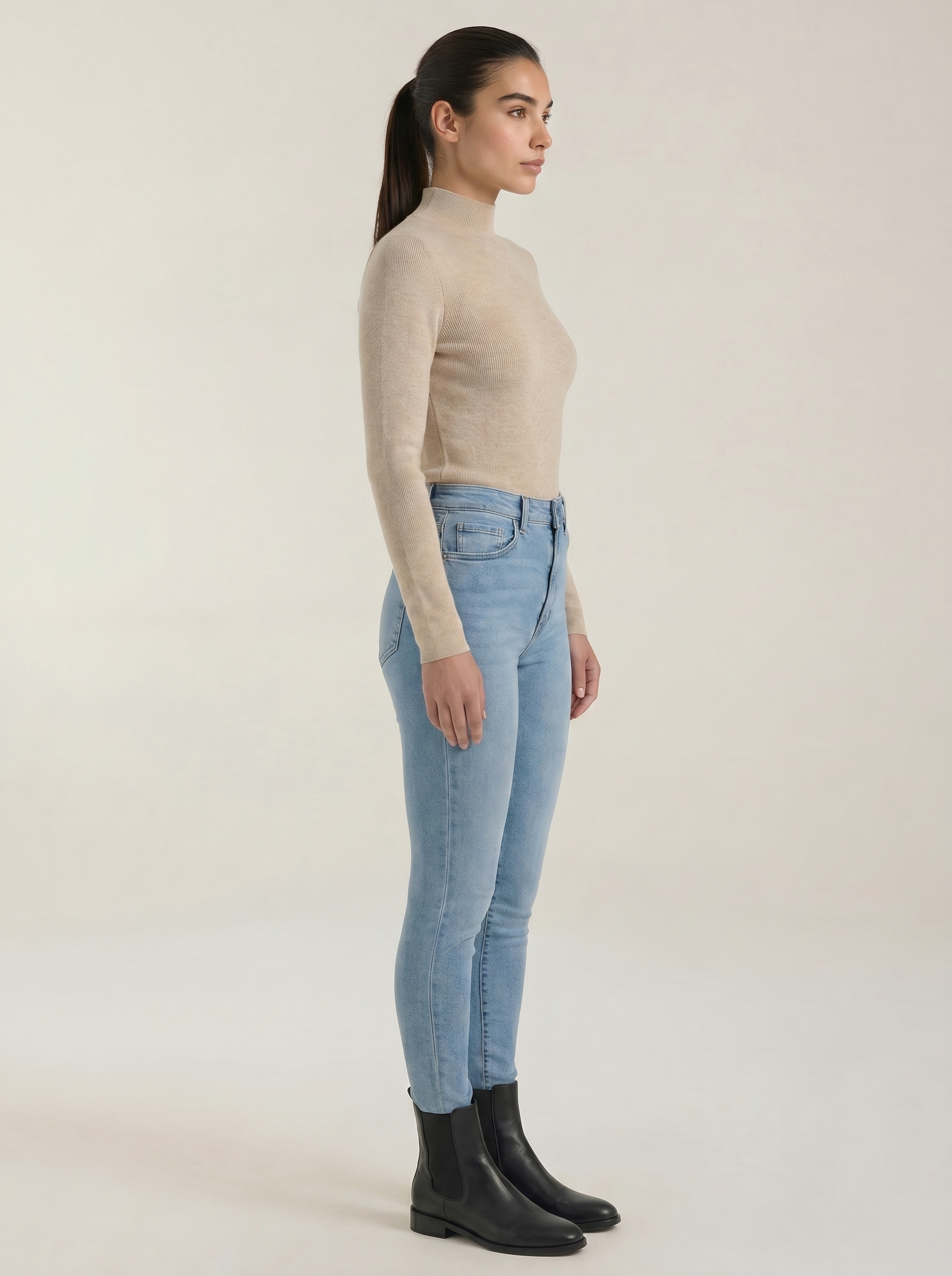 Beige cotton mock neck top with long sleeves and fitted silhouette