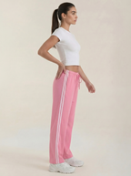 Pink wide-leg track pants with white side stripes, drawstring and elastic waist