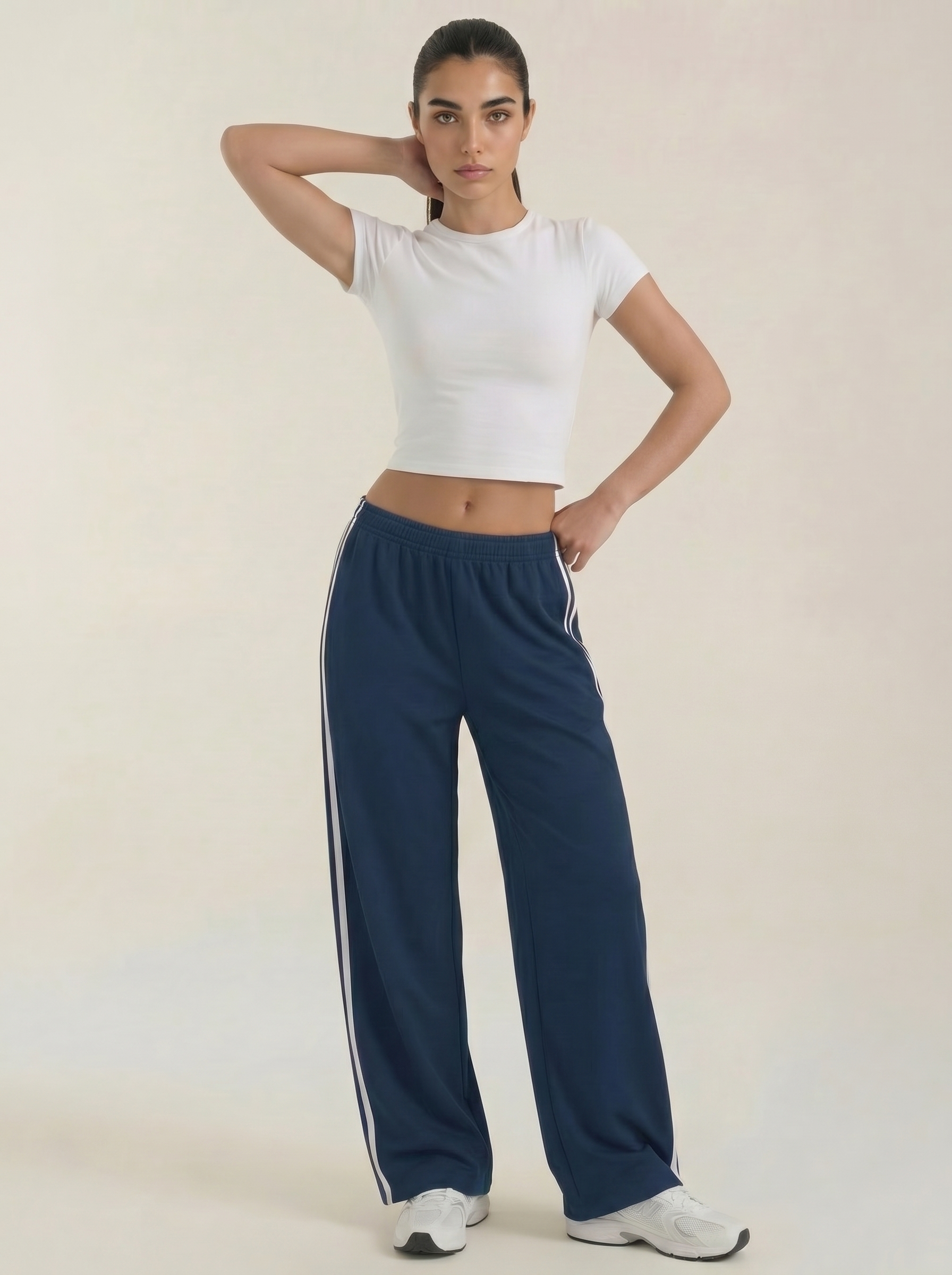 Navy wide-leg track pants with white side stripe, elastic waist and drawstring