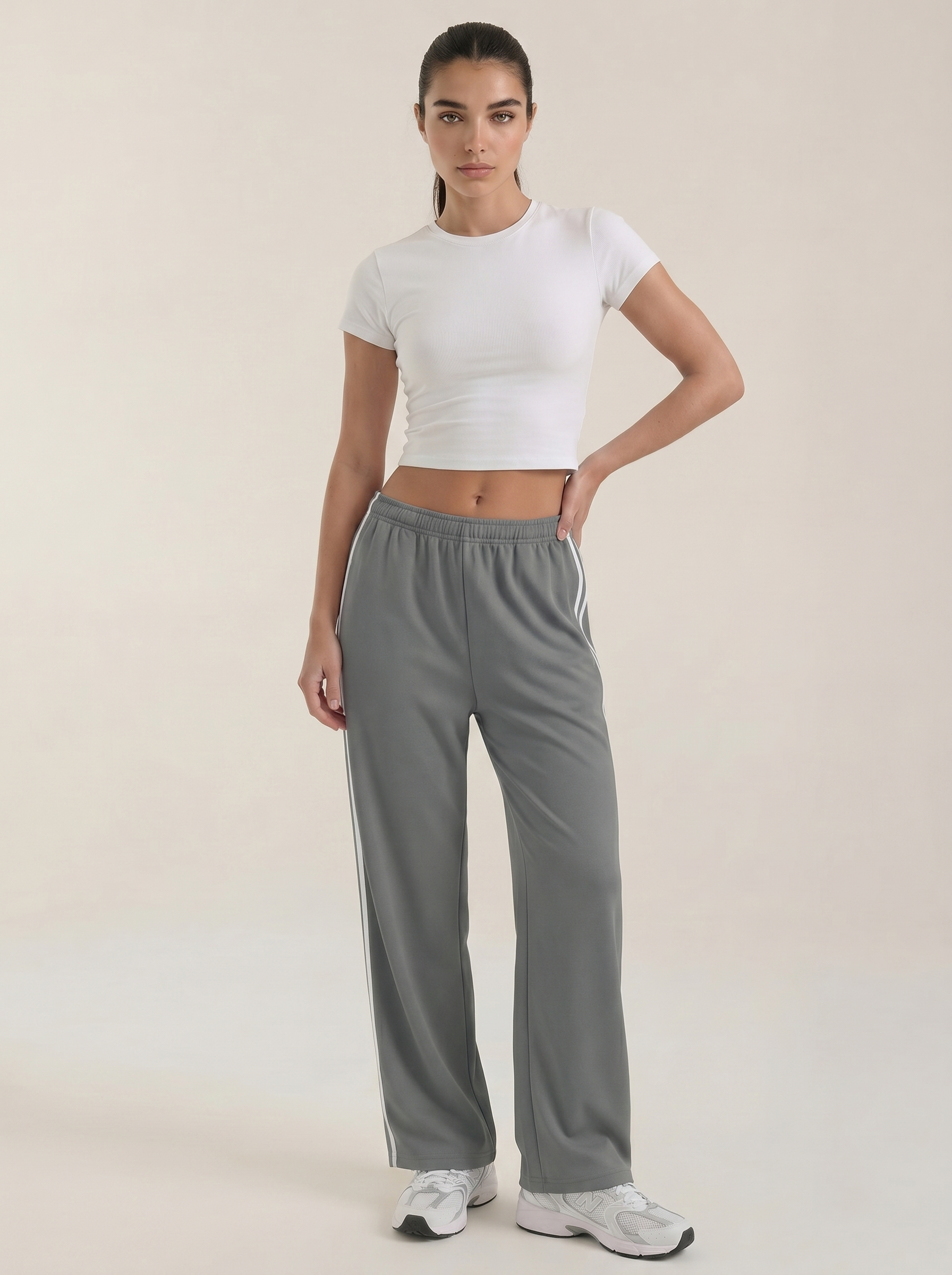 Gray wide-leg track pants with white side stripe, elastic waist and drawstring