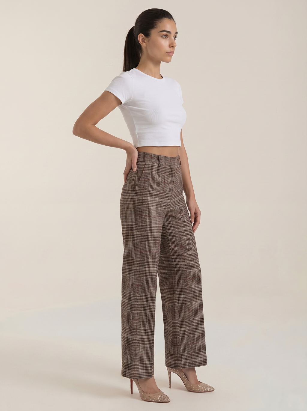 High-waisted brown plaid trousers with wide legs and side pockets
