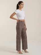 High-waisted brown plaid trousers with wide legs and side pockets