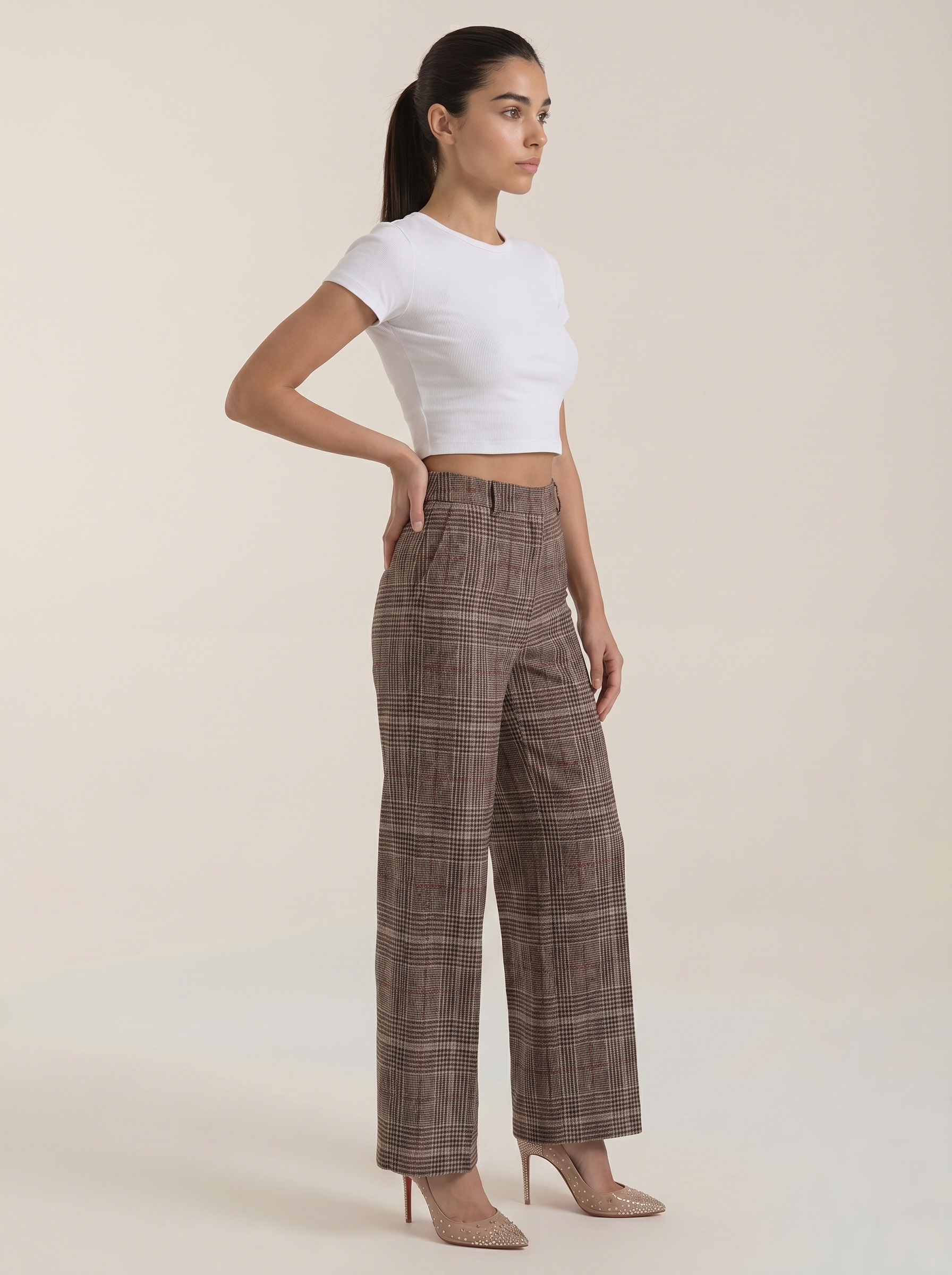 High-waisted brown plaid trousers with wide legs and side pockets