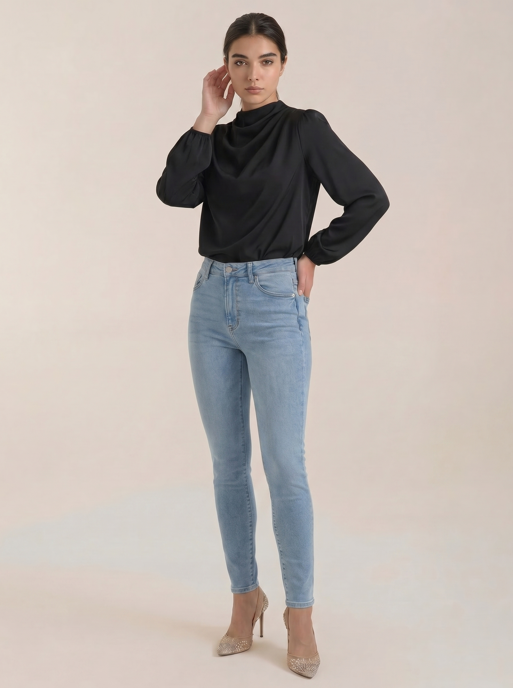 Draped long-sleeve blouse in black with cowl neckline and ruched sleeves