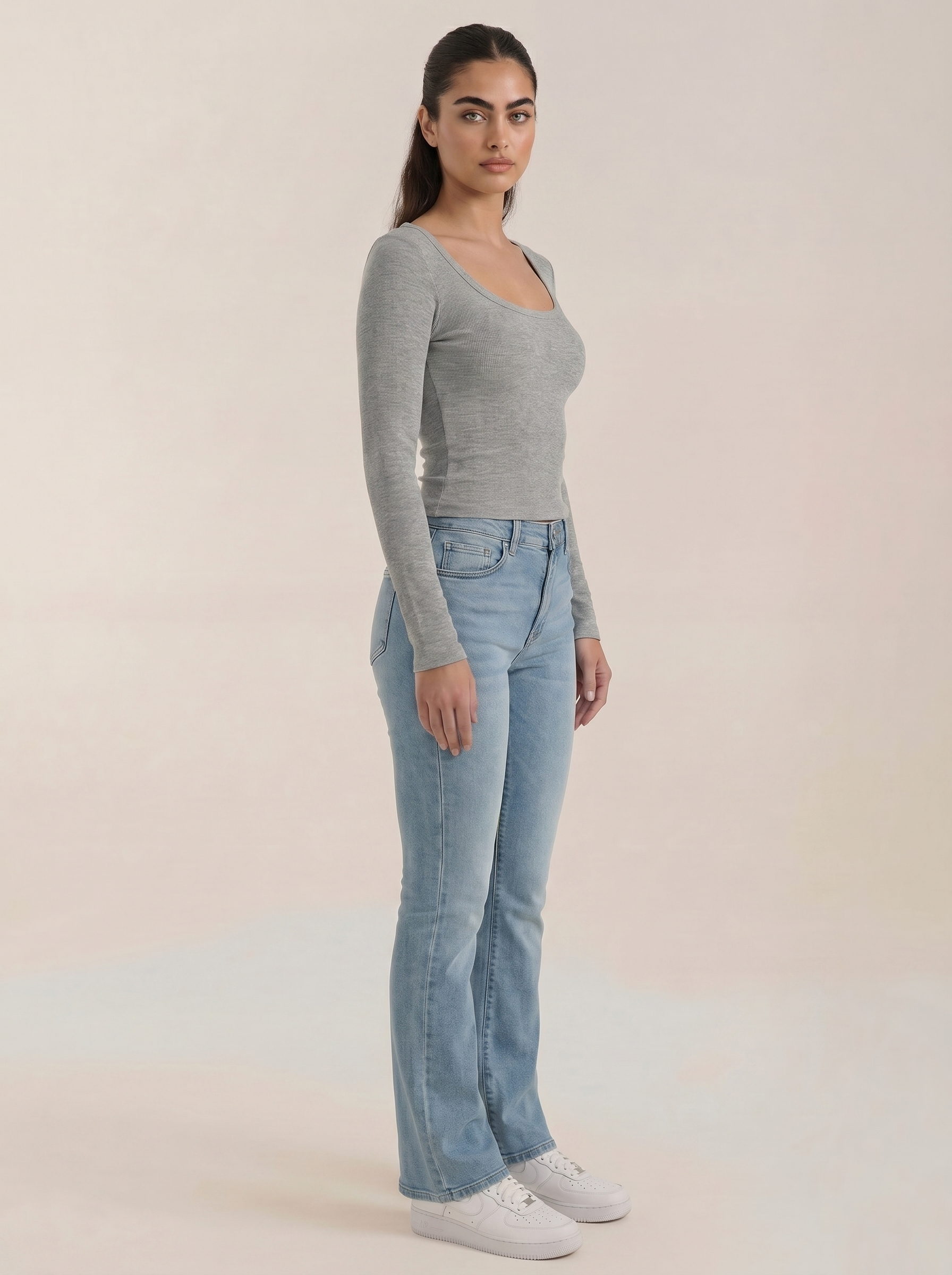 Women’s scoop neck long sleeve top in light gray, fitted side view